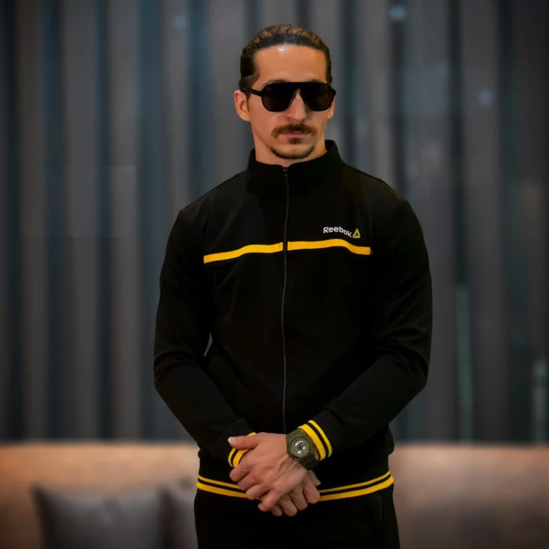 ست گرمکن و شلوار ورزشی مردانه ریبوک سایز بزرگ مشکی با نوار زرد